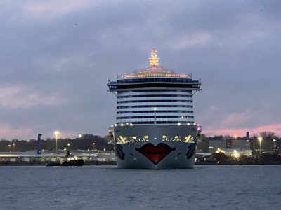 AIDAcosma cruise ship turns in the Kiel Fjord